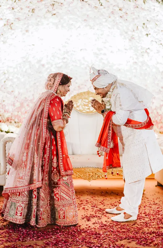 Sandeep and Kajal celebrating with garlands