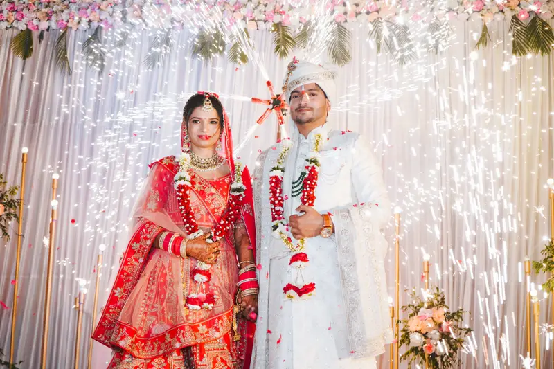 Priya and Utkarsh under a floral mandap