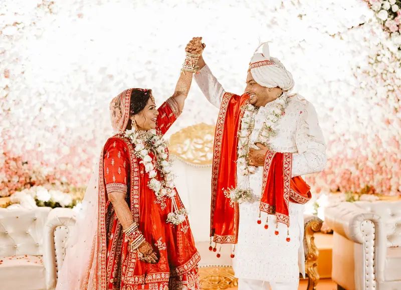 Sandeep and Kajal celebrating with garlands